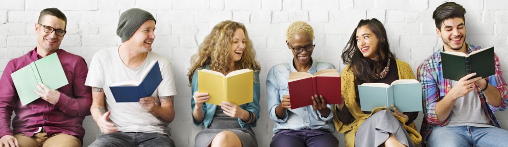 Row of young adults reading